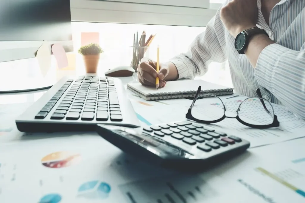 Small business owner using monthly bookkeeping services for financial management